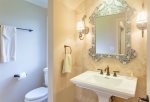 A guest bathroom sits just off the living room- perfect for visiting guests